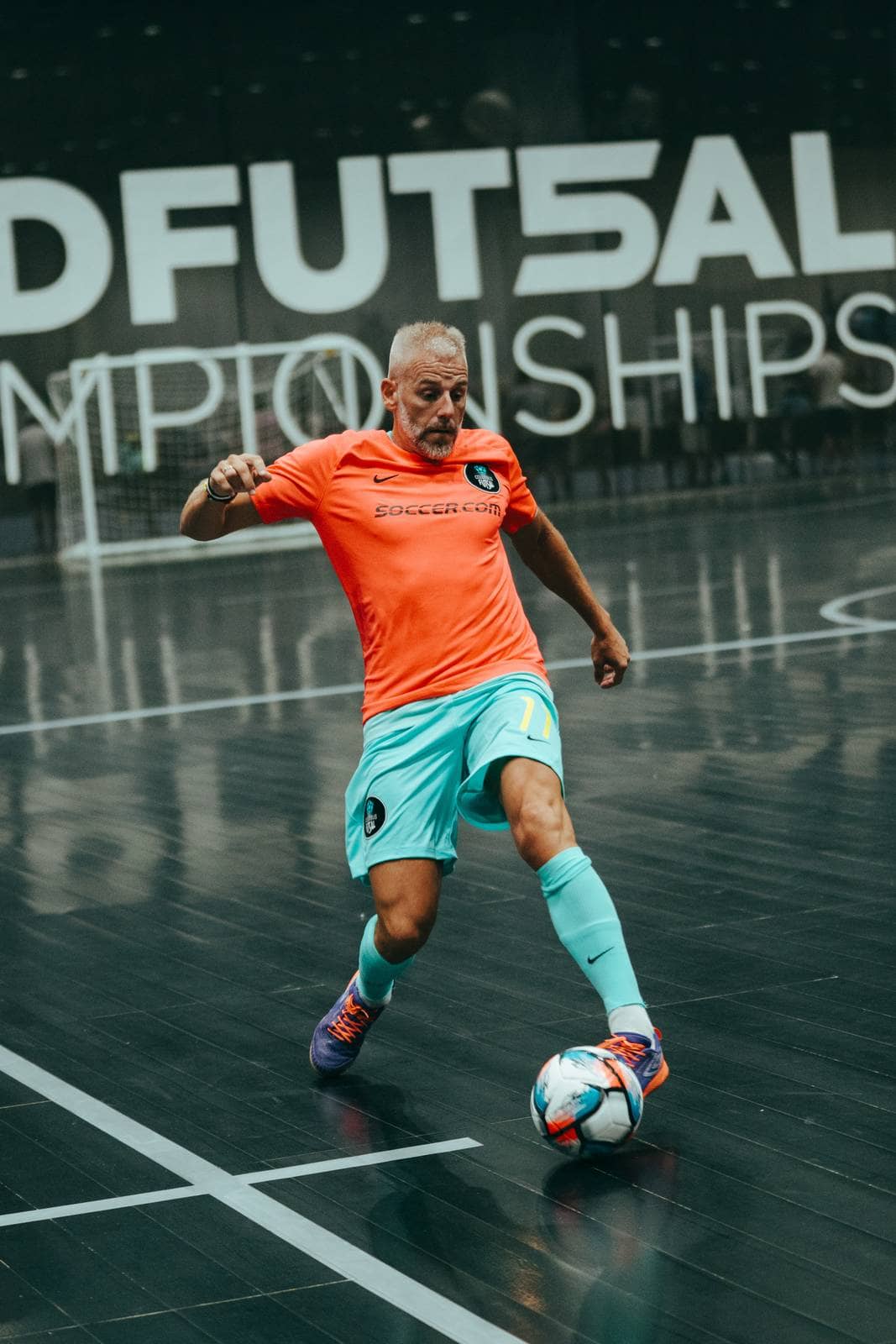 A player drives forward with the ball at his feet
